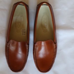 Tods luggage colored women’s loafers.